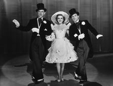 Gene Kelly, right, makes his debut alongside Judy Garland and George Murphy