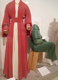  A Valentina red silk coat dress made for the original Broadway production of The Philadelphia Story and a green raw silk jumpsuit the private Hepburn wore