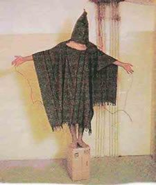 One of the iconic pictures from Abu Ghraib, branded Standard Operating Procedure by Brent Pack