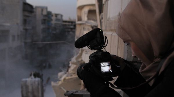 Waad al-Kateab filming the ruins of a building destroyed by bombing in besieged east Aleppo, October 2016.