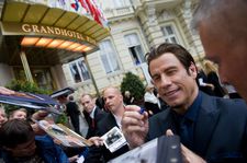 John Travolta obliges autograph hunters in Karlovy Vary.