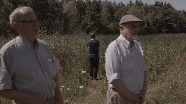 Horst von Wächter and Niklas Frank with Philippe Sands at the site of a mass grave outside Zolkiew, Ukraine in Our Fathers, The Nazis