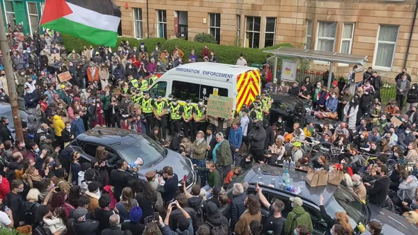 Van surrounded by protestors on Kenmure St. Felipe Bustos Sierra: 'I think there was a new understanding about about safety nets in protests at least and that an injury to one is an injury to all kind of solidarity, where everybody has to be there'