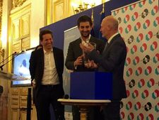 Producers Aton Soumache (left) and Dimitri Rassam receive the New French Cinema award from Unifrance president Jean-Paul Salomé at the Ministry of Foreign Affairs in Paris