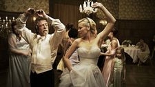 John Hurt with Kirsten Dunst in Melancholia: "I love working with Lars! I've worked with him three times. I did the narration of Dogville and Manderlay