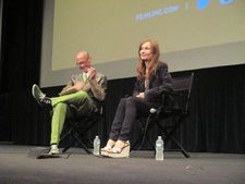John Waters shares a laugh with Isabelle Huppert: "Do you ever crack up in the middle of a really extreme scene?"