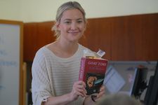 Kate Hudson holds up CR Shriver’s Goat Time book