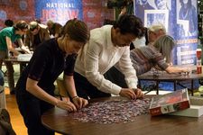 Agnes (Kelly Macdonald) and Robert (Irrfan Khan) jigsaw puzzling.
