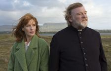 Kelly Reilly as Fiona with Father James, Brendan Gleeson: "John Michael's vision of this character. He already arrived with the idea of this green coat."