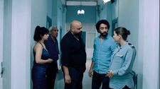 Mariam (Mariam Al Ferjani) and Youssef (Ghanem Zrelli) at the police station