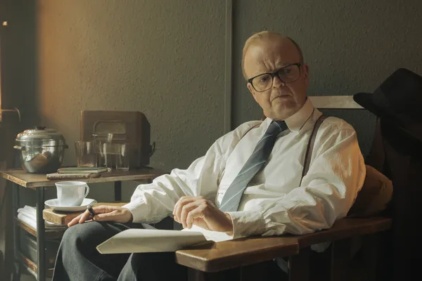 Toby Jones as Mr. Burton