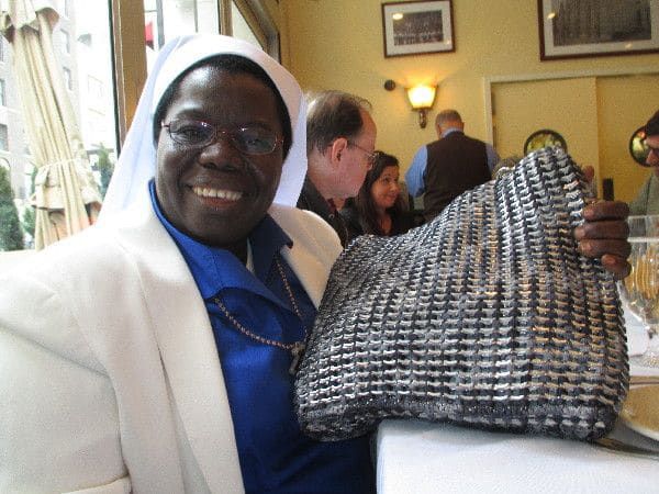 Sister Rosemary with a Sewing Hope bag: "I am a physically strong person and I strongly believe in work ethics."