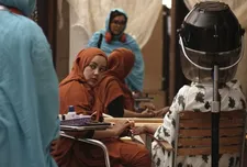 Verida working at her grandmother's beauty salon