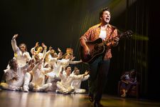 Neil Diamond (Will Swenson) reaching out with the singers/dancers