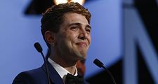 An emotional Xavier Dolan, shared the Jury Prize for his film Mommy with Jean-Luc Godard