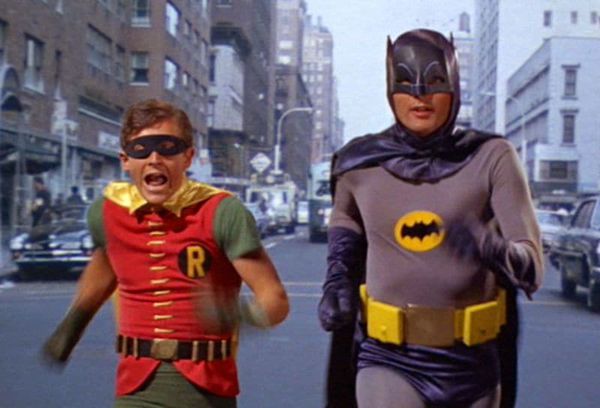 Adam West as Batman running through Gotham City with Burt Ward's Robin