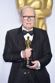 Ennio Morricone with his Oscar for The Hateful Eight