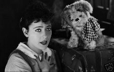 Gloria Swanson as Jenny, with her cuddly dog Flea