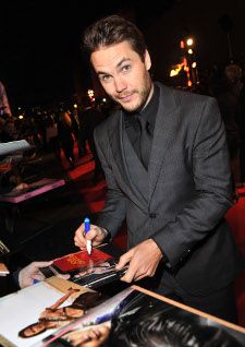 Taylor Kitsch signs autographs at the UK premiere