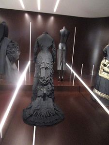 Andrew Bolton on 1877 Afternoon Dress with Alexander McQueen’s 1995 Bumster Skirt: “It’s my favourite juxtaposition”