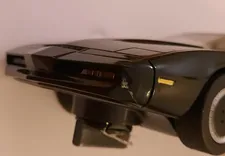 "Swapping paint" - the 'stainless steel' of the DeLorean has rubbed off on K.I.T.T.'s Tri-Helical Plasteel 1000 Molecular Bonded Shell. The stickered display screens on the dashboard are similarly non-functional