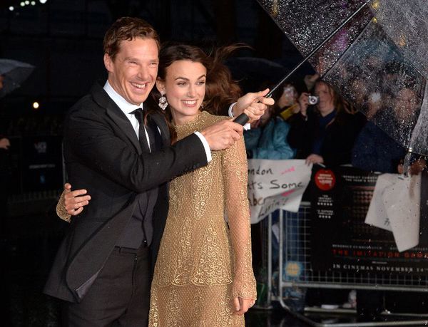 Benedict Cumberbatch and Keira Knightley smile through the rain on the red carpet at The Imitation Game's gala opening of London Film Festival