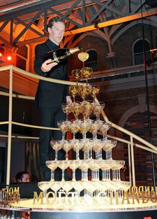 The Imitation Game star Benedict Cumberbatch tries out his champagne pouring skills at the 2014 British Independent Film Awards, where he received the Variety Award.