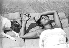 Anna Magnani with her dog in her villa in San Felice Circeo, Italy (1955)