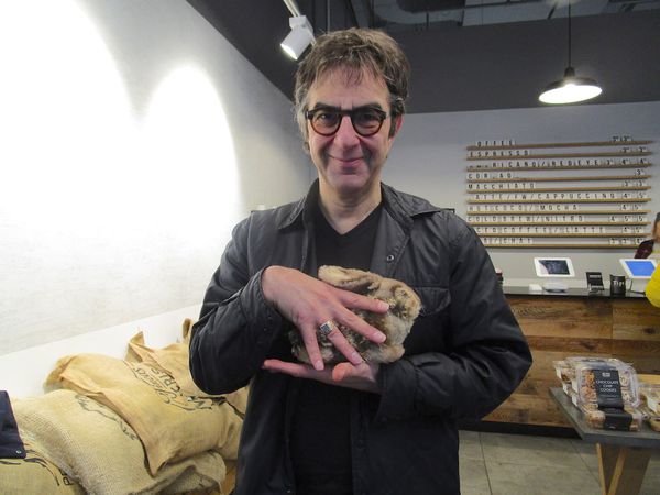 Guest Of Honour director and rabbit competition winner Atom Egoyan with Anne-Katrin Titze’s Steiff Dürer Bunny at the Seven Grams Caffe in New York