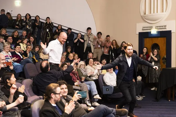 The Home game team learn that they've won the Audience Award