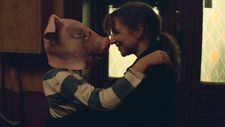 Isak (Daniel Storm Forthun Sandbye) in pig mask with his mother Anja (Andrea Bræin Hovig)