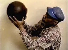 David Hammons making one of his Basketball Drawings, circa 2000