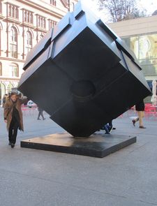 Denis Lavant rotating the cube at Astor Place in New York