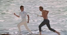 Ratso Rizzo (Dustin Hoffman) running on the beach in Miami with Joe Buck (Jon Voight)