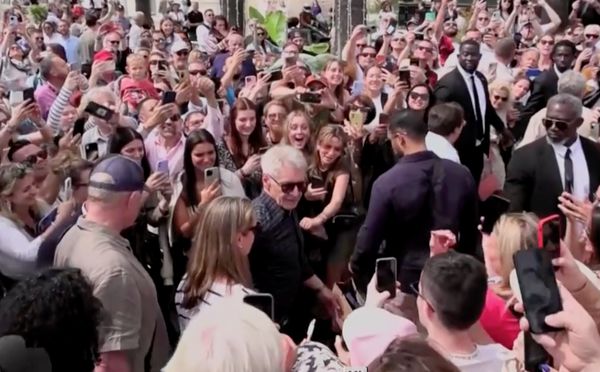 Face in the crowd: Harrison Ford submerged by well wishers at the Cannes Film Festival