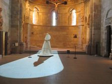 House of Balenciaga gown in the Heavenly Bodies: Fashion and the Catholic Imagination at The Met Cloisters Langon Chapel