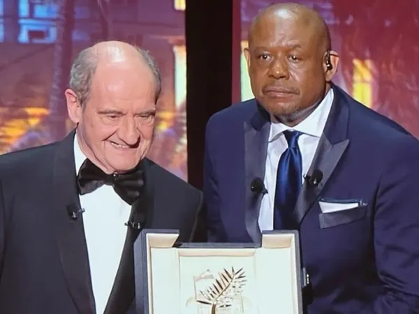 Forest Whitaker receiving his honorary Palme from Cannes outgoing President Pierre Lescure