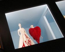 Victor & Rolf I love you evening dress (Autumn/Winter 2005-6) and Hedi Slimane for Yves Saint Laurent coat (Autumn/Winter 2016-17) in Camp: Notes on Fashion at  The Metropolitan Museum of Art