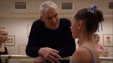 Jacques d'Amboise talks to a young student In Balanchine's Classroom