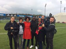 Jana Pareigis with former German National soccer player Gerald Asamoah and her Afro. Deutschland team