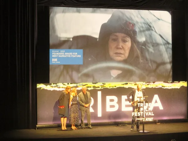 Kent Jones accepts Tribeca Film Festival Founders Award from Jane Rosenthal, Fiona Carter (AT&T), and Robert De Niro