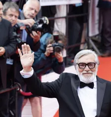 Festival president Jiří Bartoška arrives for the opening ceremony