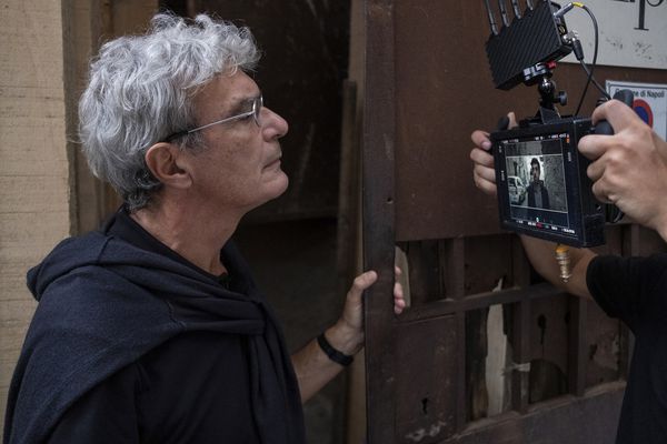In sharp focus: Mario Martone checks out Pierfrancesco Favino on the mini monitor during the filming of Nostalgia in Naples