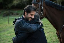 Louis (Melvil Poupaud) gives a hug to Zwy (Patrick Timsit)