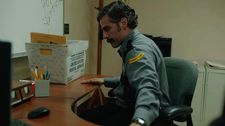 Corrections officer Richard (Oscar Isaac) in The Letter Room