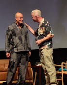 Woody Harrelson and Neil Young on stage
