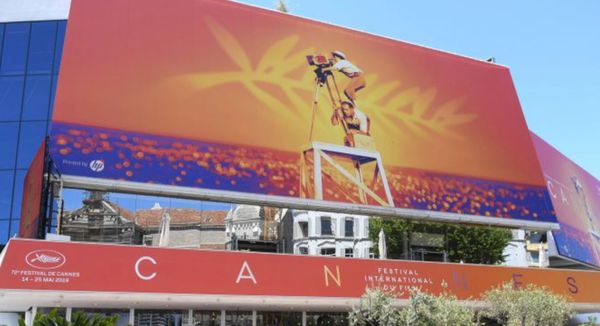 Palais des Festivals in Cannes dressed up with iconic poster image of Agnès Varda for last year - the Market or Marché normally takes place in a vast hall under the main screening rooms