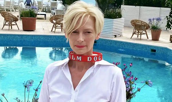 Tilda Swinton with the Palme Dog collar won by her springer spaniels