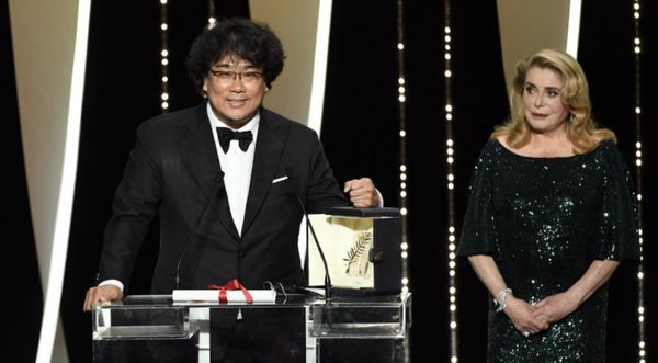 Winner Bong Joon-ho receives his Palme d’Or from Catherine Deneuve