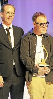 Dragonfly director Paul Andrew Williams with his trophy alongside jury member Reda Kateb